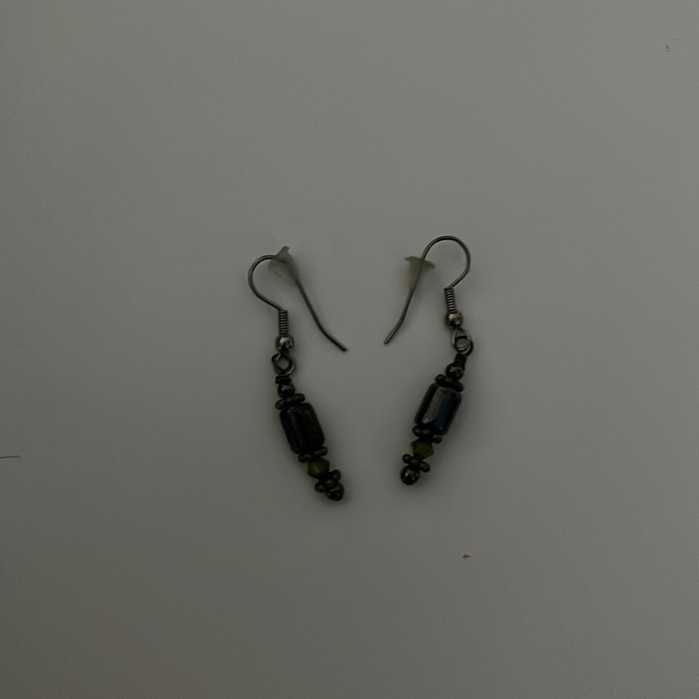 purple and silver earrings with a little bit of yellow